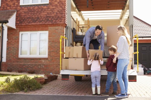 Professional movers carrying furniture in Shoreditch