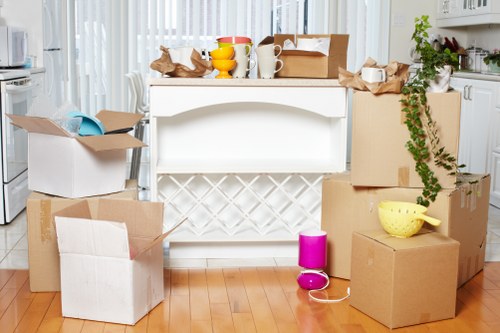 Packed boxes and furniture prepared for a Shoreditch removal van move