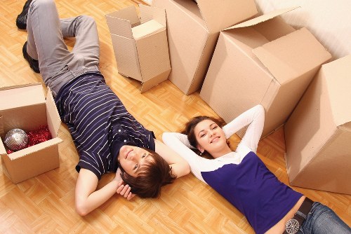 Professional movers carrying office furniture in Shoreditch